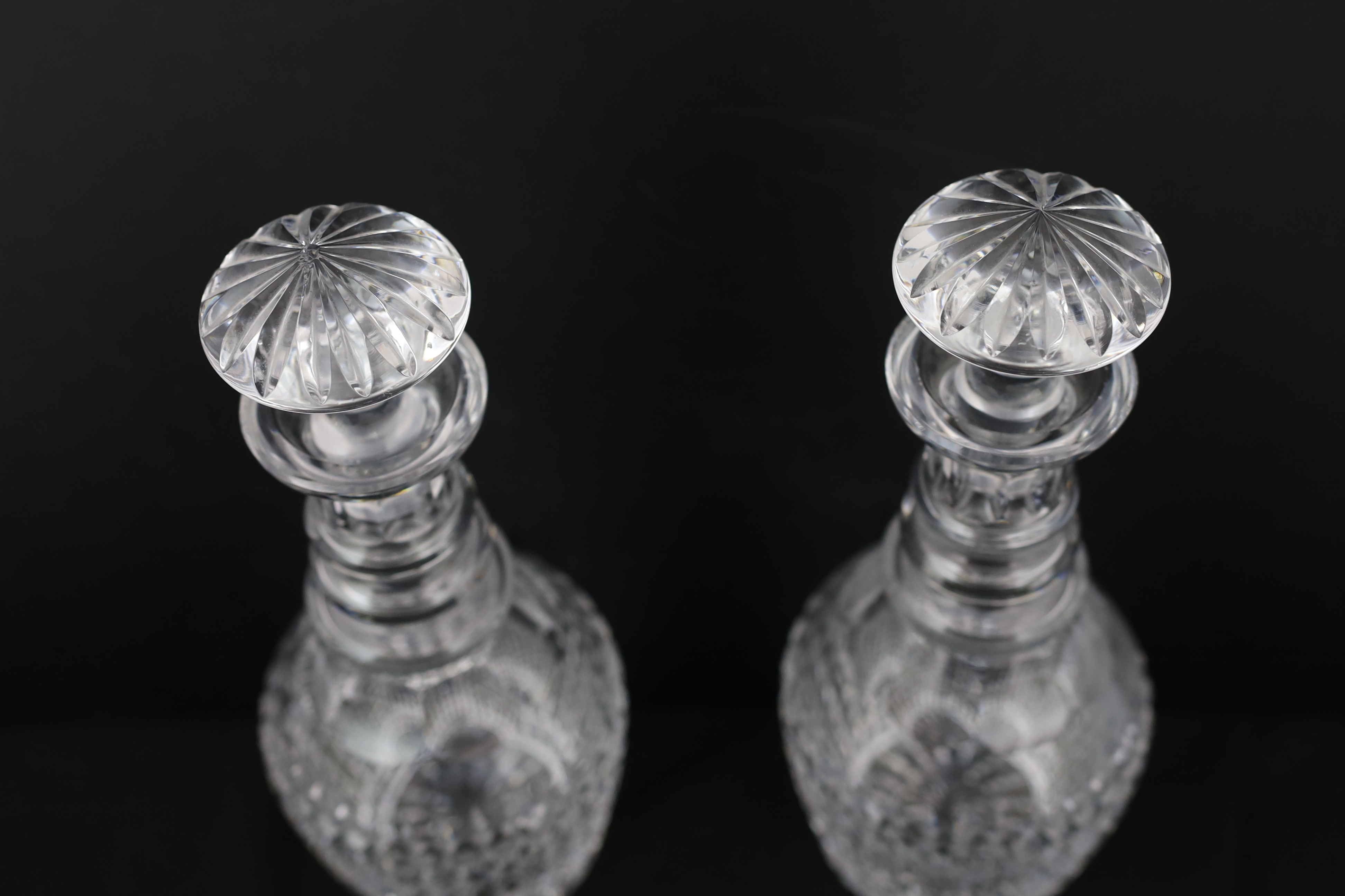A pair Regency-style hob-nail cut glass decanters and stoppers, c.1900, Please note this lot attracts an additional import tax of 5% on the hammer price